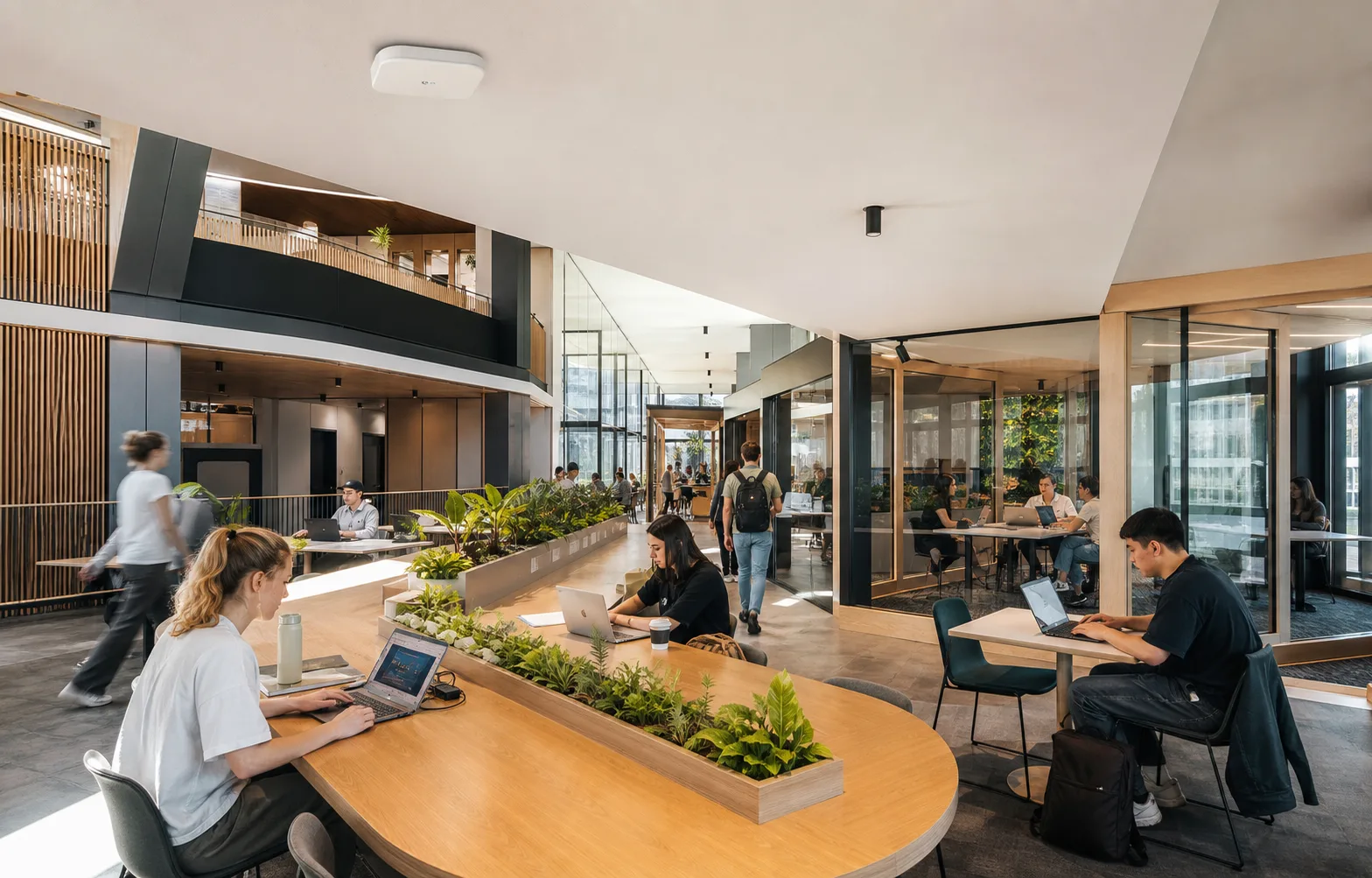 People using reliable wireless connectivity inside a modern enterprise campus workspace